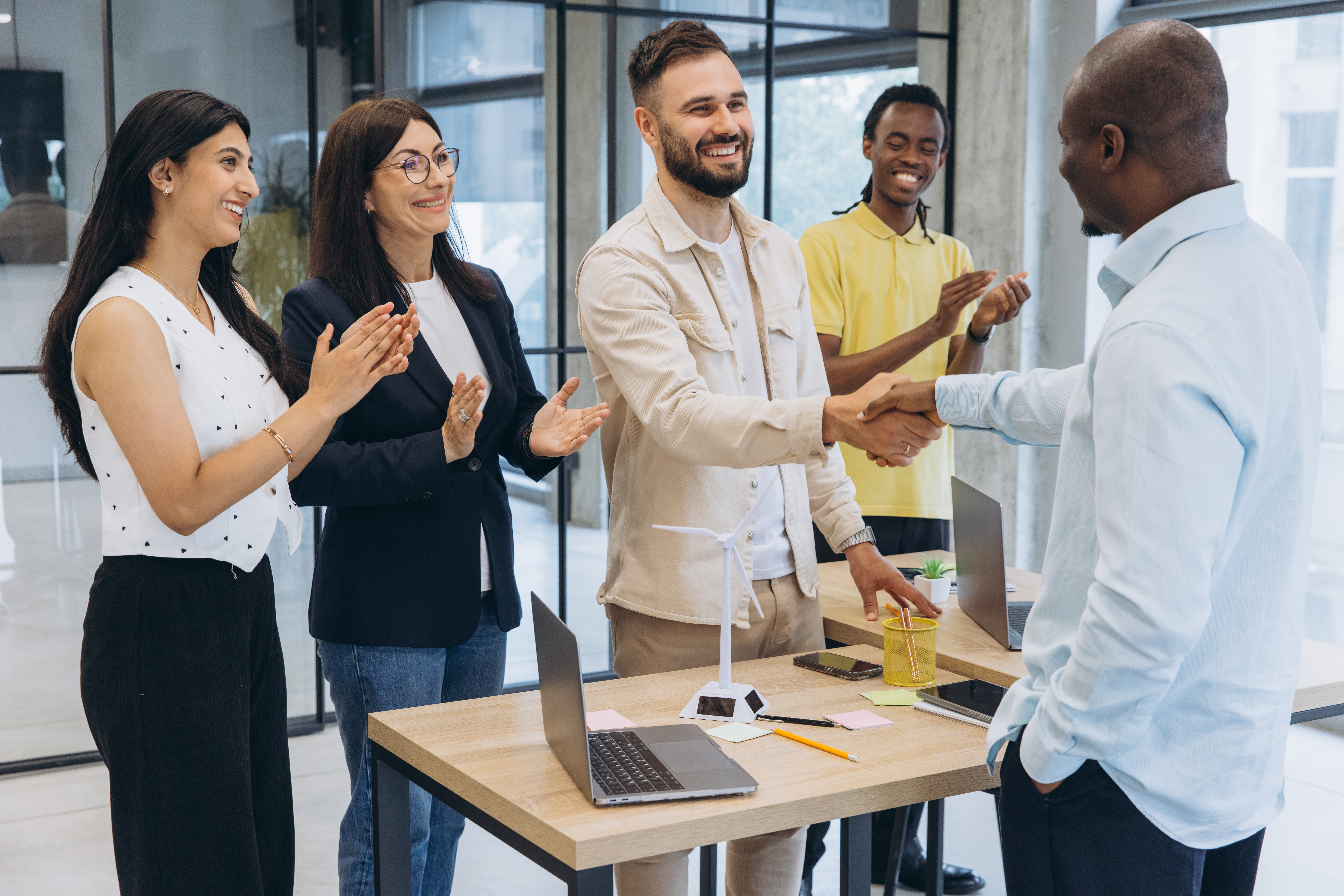 A sales team celebrating a top performer